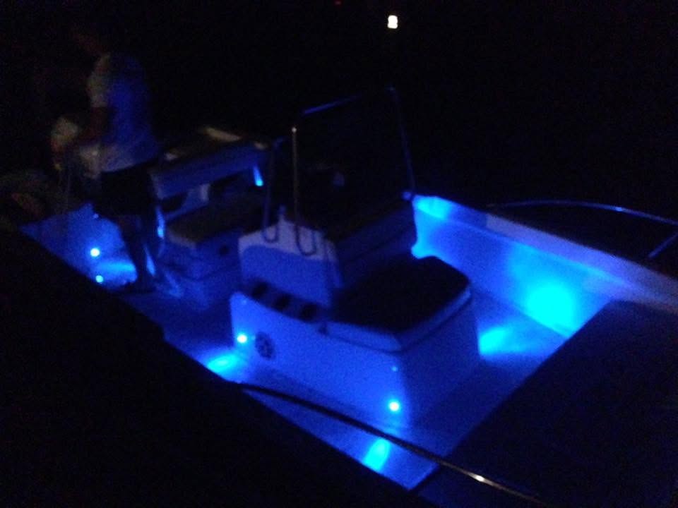Boat deck with blue LED lighting at night